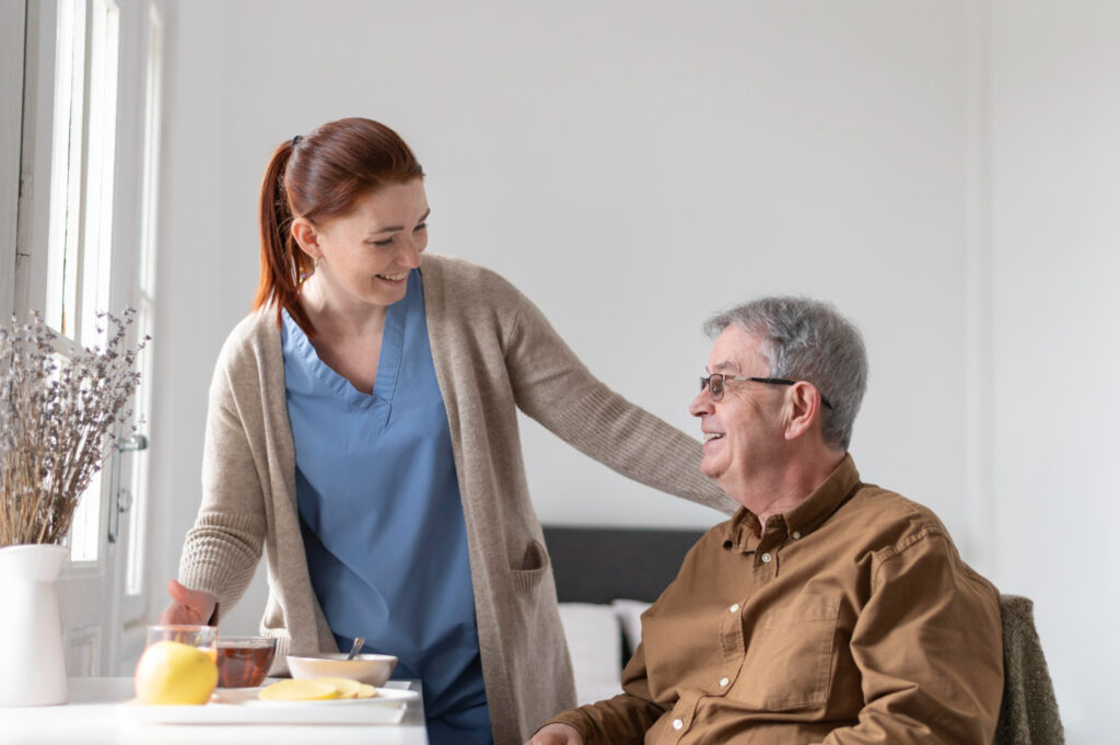 Medicaid support programs in Staten Island NY– caregiver helping senior at home